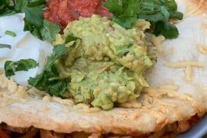 close up photo of Guacamole on a quesadilla