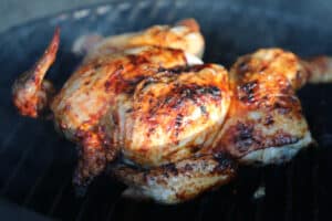 photo of a Spatchcock Chicken on a bbq grill