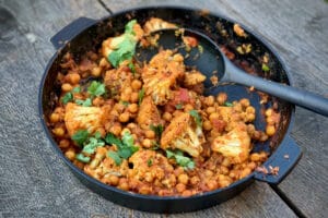 photo of Chickpea and Cauliflower Curry in a skillet on a table