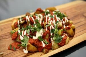 photo of Patatas Bravas on a board