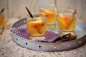 photo of three glasses of Mulled Cider on a silver tray