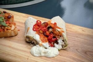 Beer-braised chicken burrito photo of Beer-braised chicken burrito on a baord