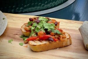 Beer braised beans on toast photo of Beer braised beans on toast on a baord