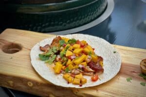 Beer-braised pork taco photo of Beer-braised pork taco on a board