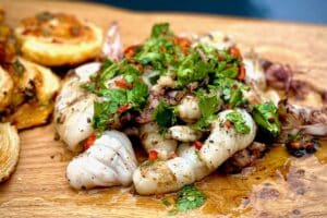 photo of Baby Squid with Chimichurri on a board