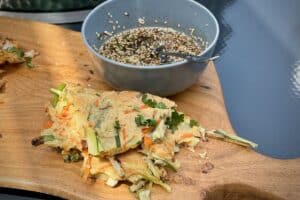 Korean Pancakes photo of Korean Pancakes with a dipping sauce on a board