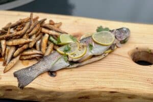 Rainbow Trout en Papillote photo of Rainbow Trout en Papillote on a board