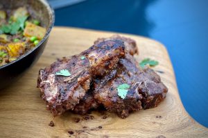Sweet and spicy goat chops photo of several sweet and spicy goat chops on a board
