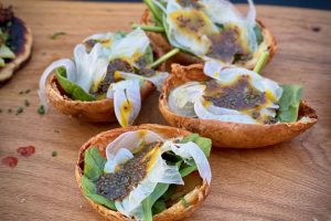 Crispy Potato Skins with Spinach and Fennel photo of Crispy Potato Skins with Spinach and Fennel on a board