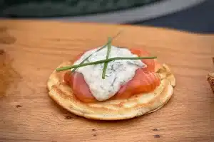 Smoked Salmon Blinis photo of Smoked Salmon Blinis on a board