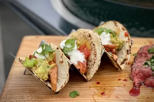 Shredded Chicken Tacos a photo of Shredded Chicken Tacos in a stand on a board