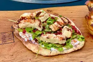 photo of Grilled halloumi flatbread on a board