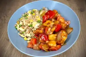 Sweet and sour chicken photo of Sweet and sour chicken in a grey bowl