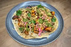 Indian sweet potato with chutneys and a mint paratha photo of Indian Sweet Potato with Chutneys and a Mint Paratha