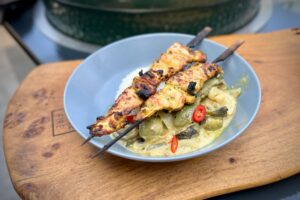 Thai Green Chicken Curry photo of Thai Chicken skewers on a Green Curry on a bed of a rice in a bowl