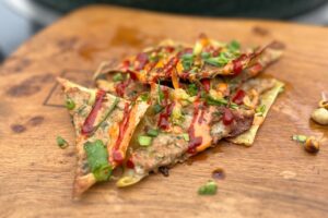 Thai Pork Dumpling Nachos photo of Thai Pork Dumpling Nachos on a board