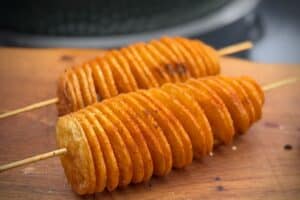 photo of Tornado Potatoes on a wooden skewer on a board
