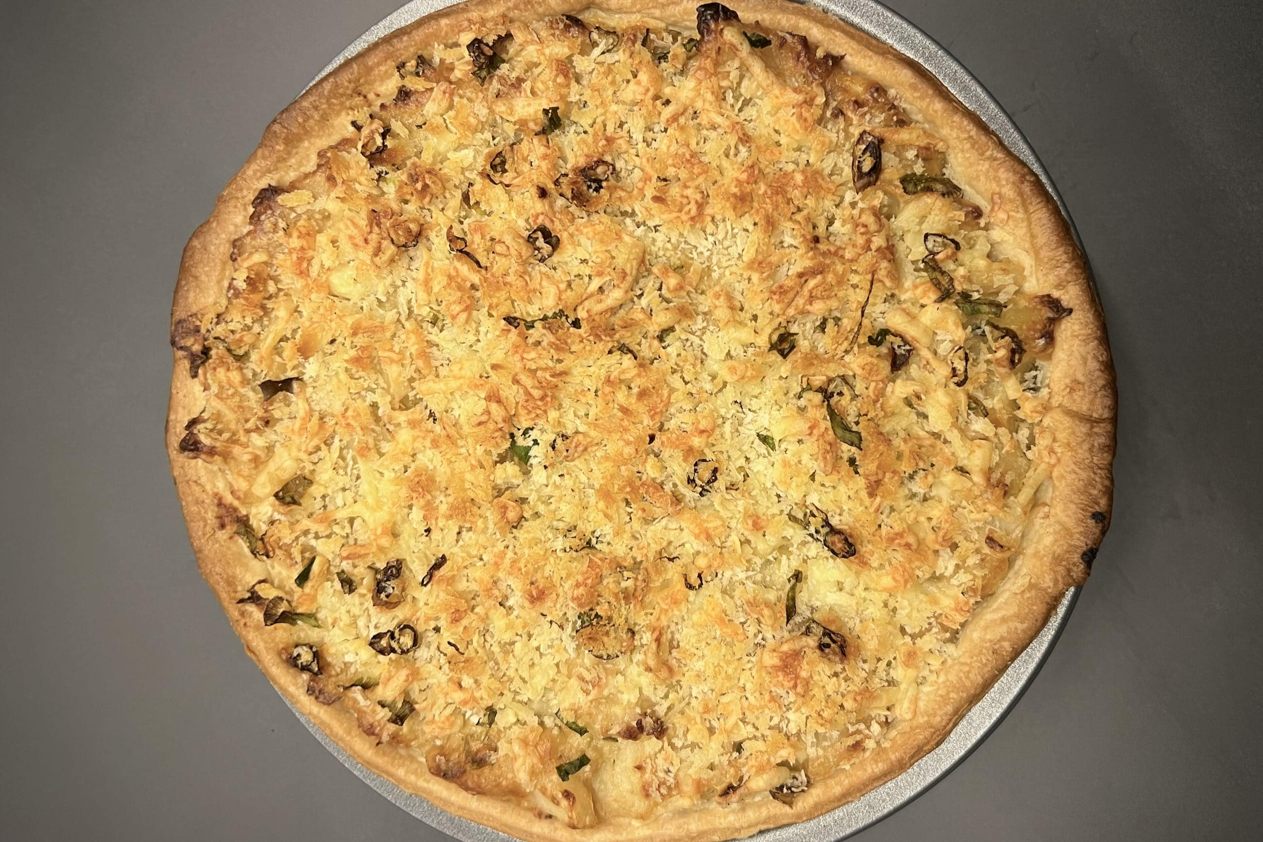 A photo of a Homity Pie cooked on the Big Green Egg.